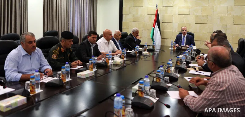 Palestinian Prime Minister Rami Hamdallah chairs a meeting with security chiefs at his office, in the West Bank city of Ramallah on July 18, 2017. Photo by Prime Minister Office