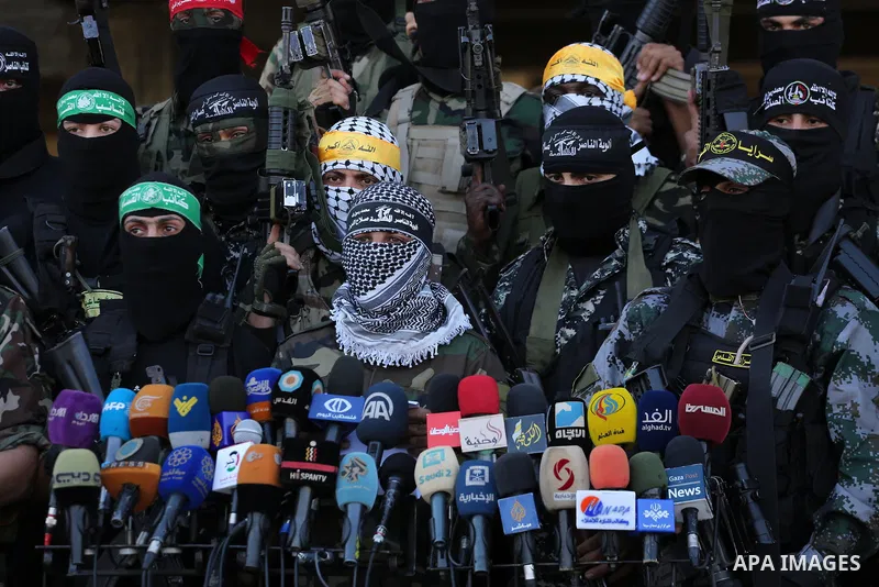 Palestinian militants from different local factions hold a press conference to refuse closure of the Al-Aqsa Mosque compound by Israel in Gaza City on July 18, 2017. Photo by Mohammed Asad