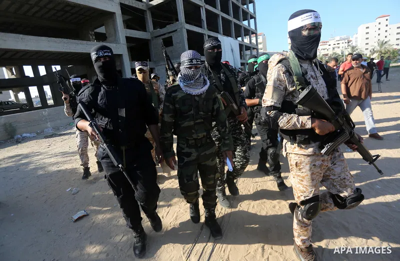 Palestinian militants from different local factions arrive to hold a press conference to refuse closure of the Al-Aqsa Mosque compound by Israel in Gaza City on July 18, 2017. Photo by Mohammed Asad