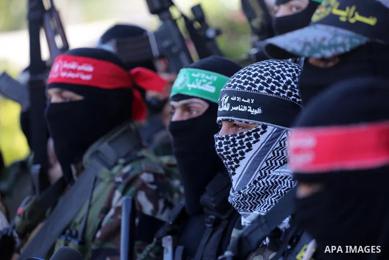Palestinian militants from different local factions hold a press conference to refuse closure of the Al-Aqsa Mosque compound by Israel in Gaza City on July 18, 2017. Photo by Mohammed Asad