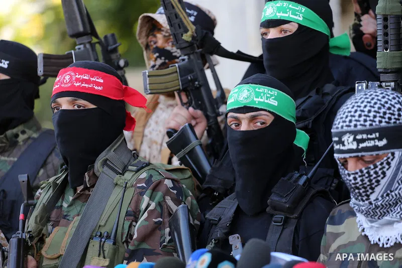 Palestinian militants from different local factions hold a press conference to refuse closure of the Al-Aqsa Mosque compound by Israel in Gaza City on July 18, 2017. Photo by Mohammed Asad