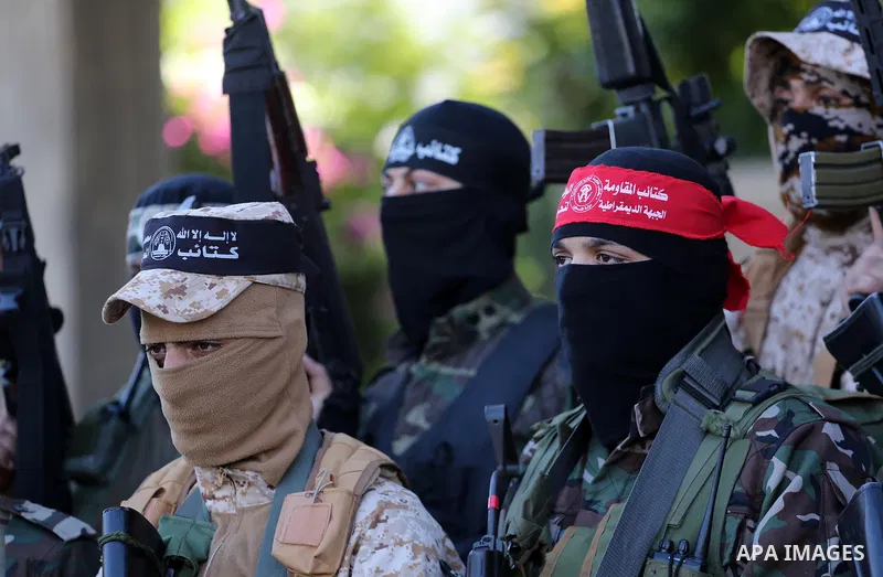 Palestinian militants from different local factions hold a press conference to refuse closure of the Al-Aqsa Mosque compound by Israel in Gaza City on July 18, 2017. Photo by Mohammed Asad