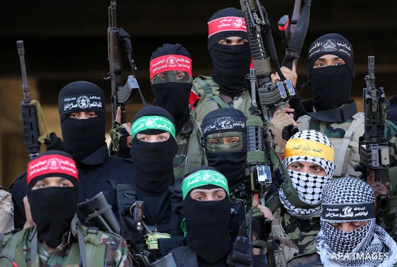 Palestinian militants from different local factions hold a press conference to refuse closure of the Al-Aqsa Mosque compound by Israel in Gaza City on July 18, 2017. Photo by Mohammed Asad