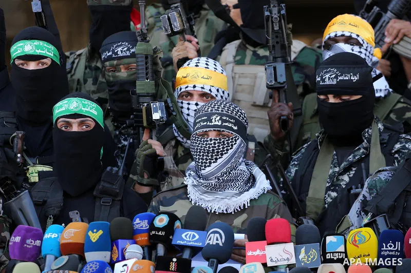 Palestinian militants from different local factions hold a press conference to refuse closure of the Al-Aqsa Mosque compound by Israel in Gaza City on July 18, 2017. Photo by Mohammed Asad