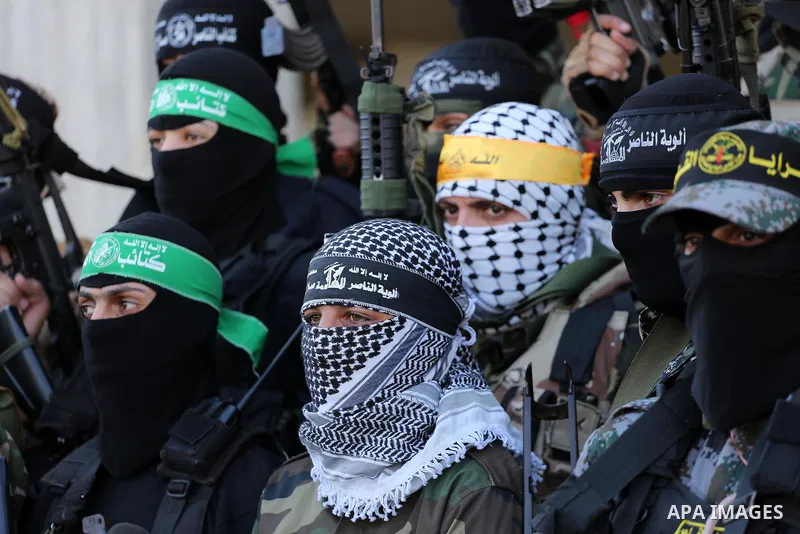 Palestinian militants from different local factions hold a press conference to refuse closure of the Al-Aqsa Mosque compound by Israel in Gaza City on July 18, 2017. Photo by Mohammed Asad