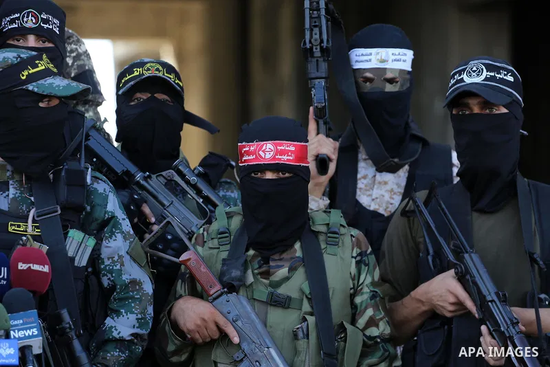 Palestinian militants from different local factions hold a press conference to refuse closure of the Al-Aqsa Mosque compound by Israel in Gaza City on July 18, 2017. Photo by Mohammed Asad