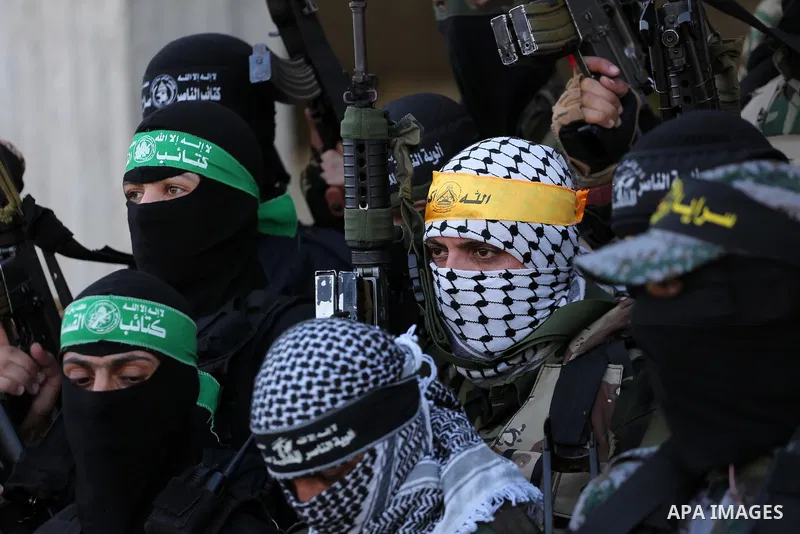Palestinian militants from different local factions hold a press conference to refuse closure of the Al-Aqsa Mosque compound by Israel in Gaza City on July 18, 2017. Photo by Mohammed Asad