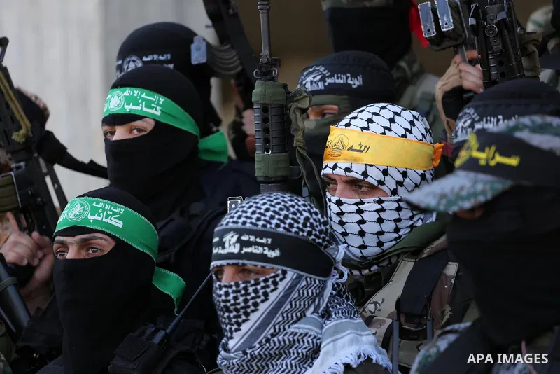 Palestinian militants from different local factions hold a press conference to refuse closure of the Al-Aqsa Mosque compound by Israel in Gaza City on July 18, 2017. Photo by Mohammed Asad
