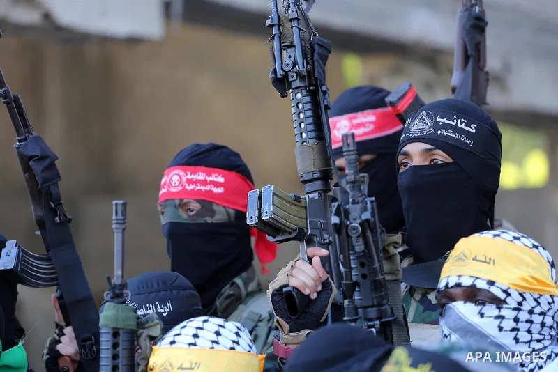 Palestinian militants from different local factions hold a press conference to refuse closure of the Al-Aqsa Mosque compound by Israel in Gaza City on July 18, 2017. Photo by Mohammed Asad