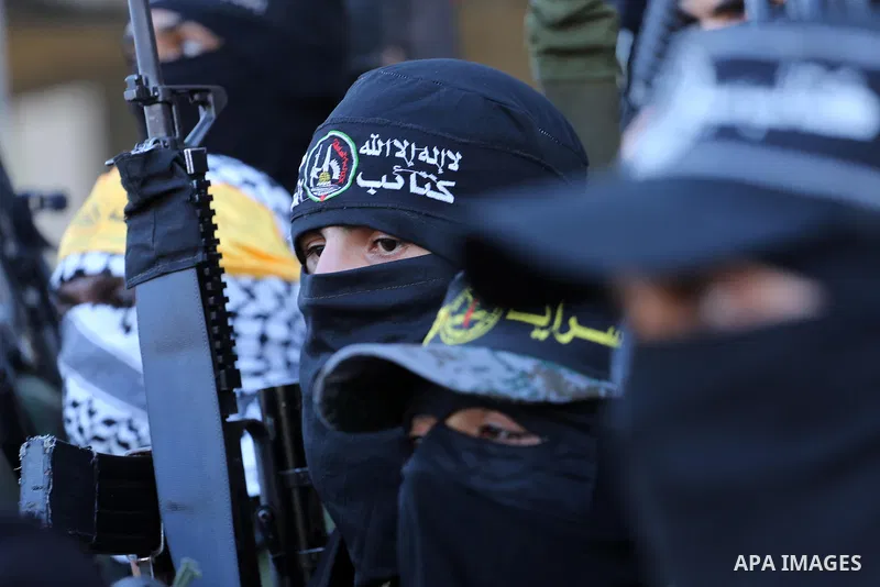 Palestinian militants from different local factions hold a press conference to refuse closure of the Al-Aqsa Mosque compound by Israel in Gaza City on July 18, 2017. Photo by Mohammed Asad