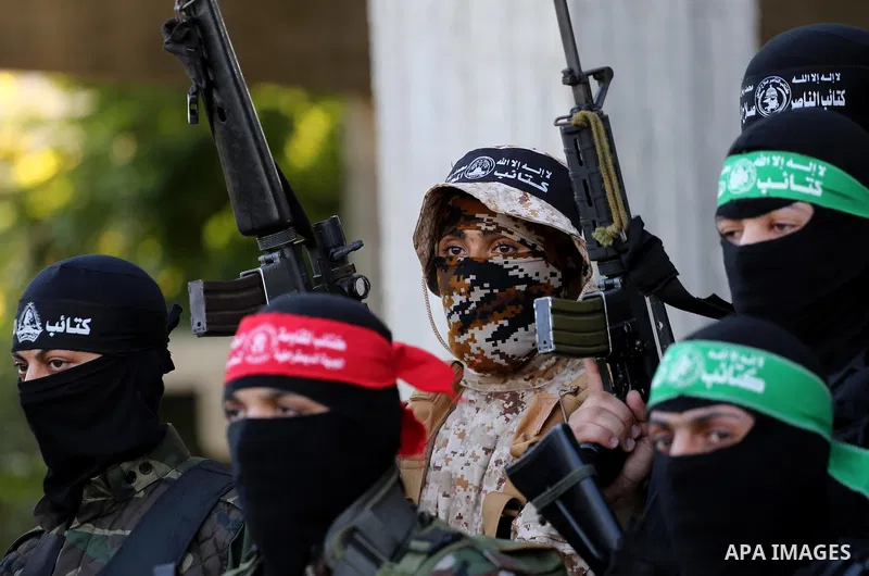 Palestinian militants from different local factions hold a press conference to refuse closure of the Al-Aqsa Mosque compound by Israel in Gaza City on July 18, 2017. Photo by Mohammed Asad