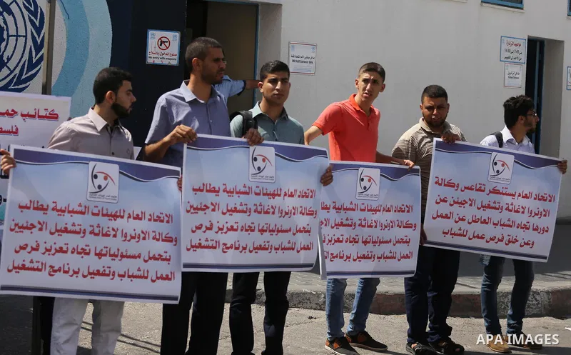 Palestinians take part in a protest against the worsening crisis of power outages land Israeli blockade on Gaza strip, in Gaza City on July 19, 2017. Photo by Mohammed Asad