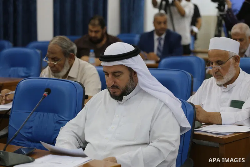 Members of the Palestinian legislative council from Hamas movement attend a meeting at the legislative council in Gaza City on July 19, 2017. Photo by Mohammed Asad