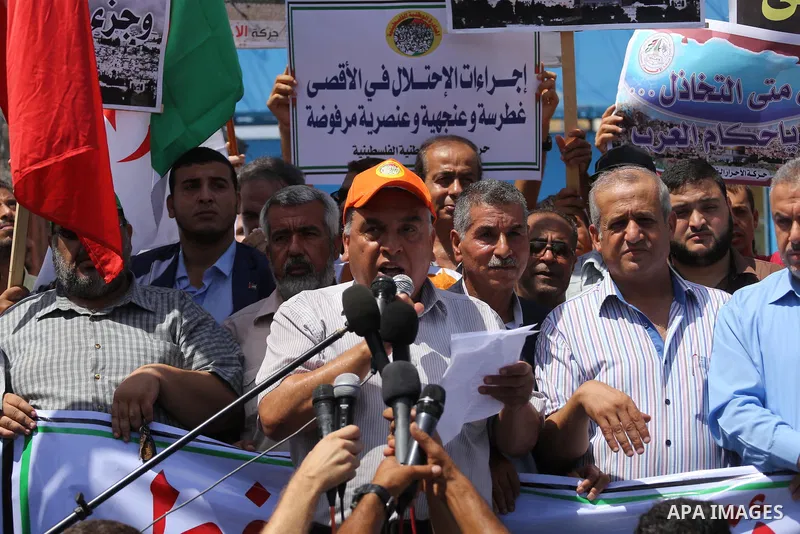 Palestinians take part in a protest against the recent closure of the Al-Aqsa Mosque compound by Israel, in Gaza City on July 19, 2017. Photo by Mohammed Asad