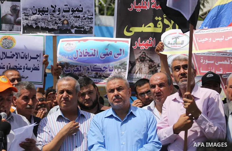 Palestinians take part in a protest against the recent closure of the Al-Aqsa Mosque compound by Israel, in Gaza City on July 19, 2017. Photo by Mohammed Asad