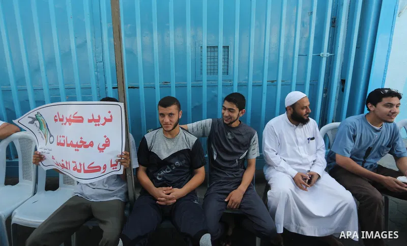 Palestinians take part in a protest against the worsening crisis of power outages land Israeli blockade on Gaza strip, in Gaza City on July 19, 2017. Photo by Mohammed Asad
