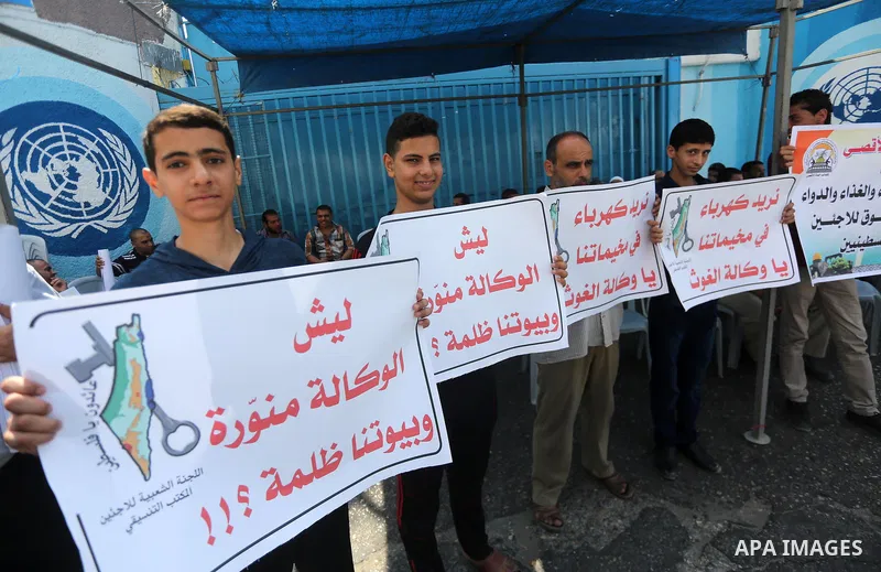 Palestinians take part in a protest against the worsening crisis of power outages land Israeli blockade on Gaza strip, in Gaza City on July 19, 2017. Photo by Mohammed Asad