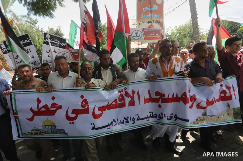 Palestinians take part in a protest against the recent closure of the Al-Aqsa Mosque compound by Israel, in Gaza City on July 19, 2017. Photo by Mohammed Asad