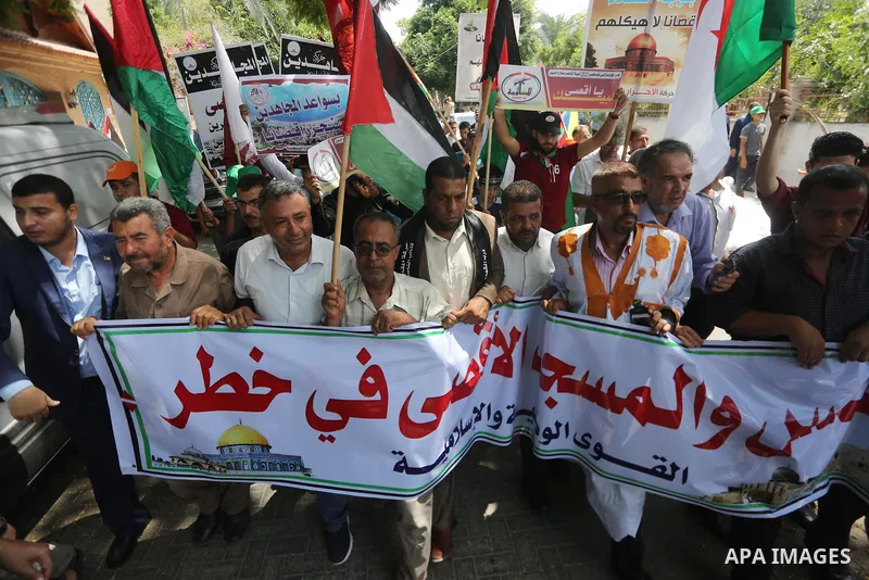 Palestinians take part in a protest against the recent closure of the Al-Aqsa Mosque compound by Israel, in Gaza City on July 19, 2017. Photo by Mohammed Asad