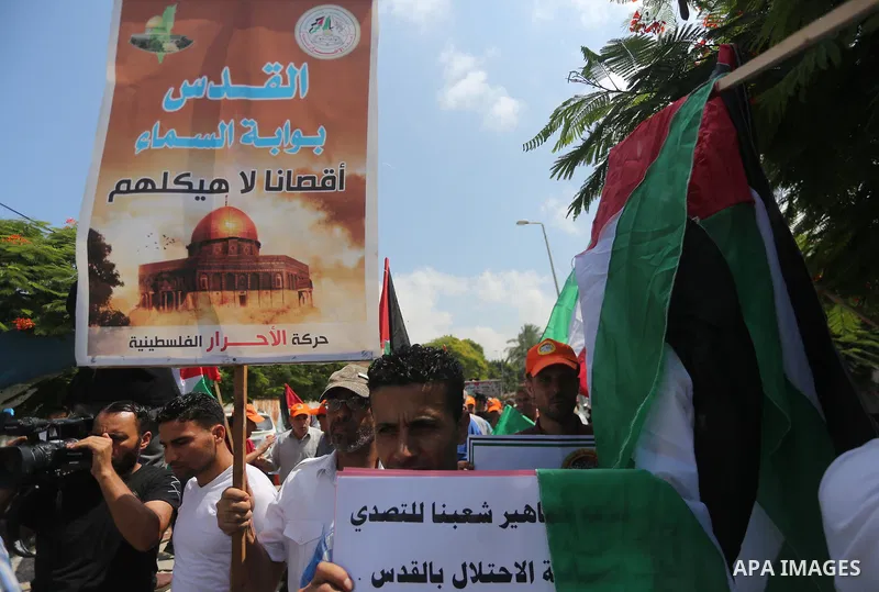 Palestinians take part in a protest against the recent closure of the Al-Aqsa Mosque compound by Israel, in Gaza City on July 19, 2017. Photo by Mohammed Asad