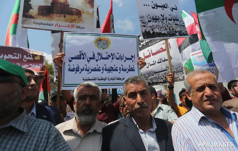 Palestinians take part in a protest against the recent closure of the Al-Aqsa Mosque compound by Israel, in Gaza City on July 19, 2017. Photo by Mohammed Asad