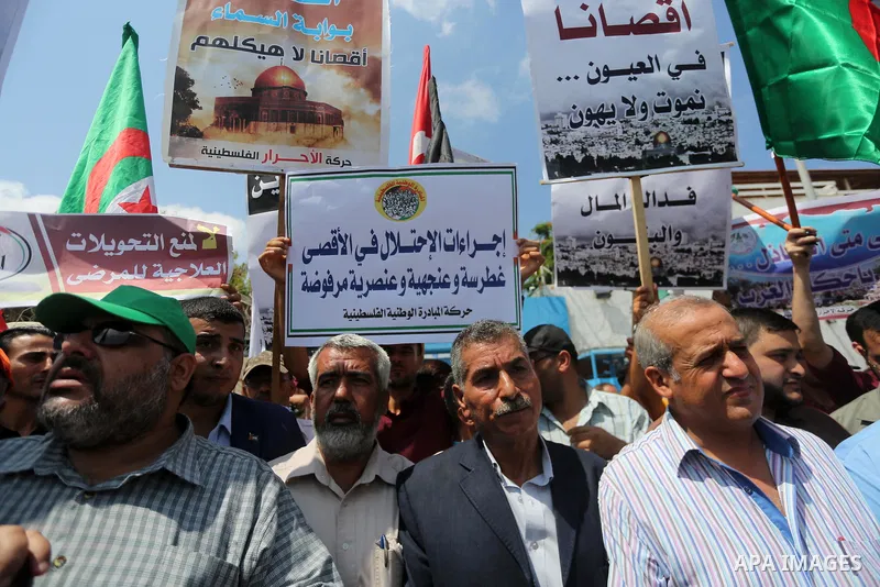 Palestinians take part in a protest against the recent closure of the Al-Aqsa Mosque compound by Israel, in Gaza City on July 19, 2017. Photo by Mohammed Asad