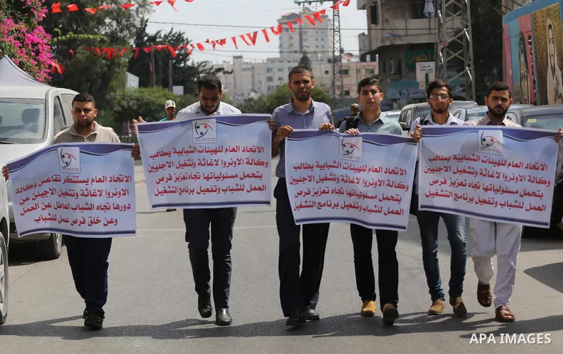 Palestinians take part in a protest against the worsening crisis of power outages land Israeli blockade on Gaza strip, in Gaza City on July 19, 2017. Photo by Mohammed Asad