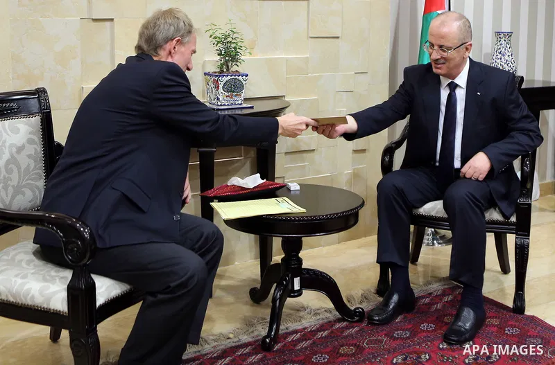 Palestinian Prime Minister Rami Hamdallah meets with German Representative to Palestine Peter Perverth, at his office in the West Bank city of Ramallah on July 19, 2017. Photo by Prime Minister Office