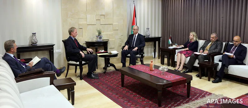 Palestinian Prime Minister Rami Hamdallah meets with German Representative to Palestine Peter Perverth, at his office in the West Bank city of Ramallah on July 19, 2017. Photo by Prime Minister Office