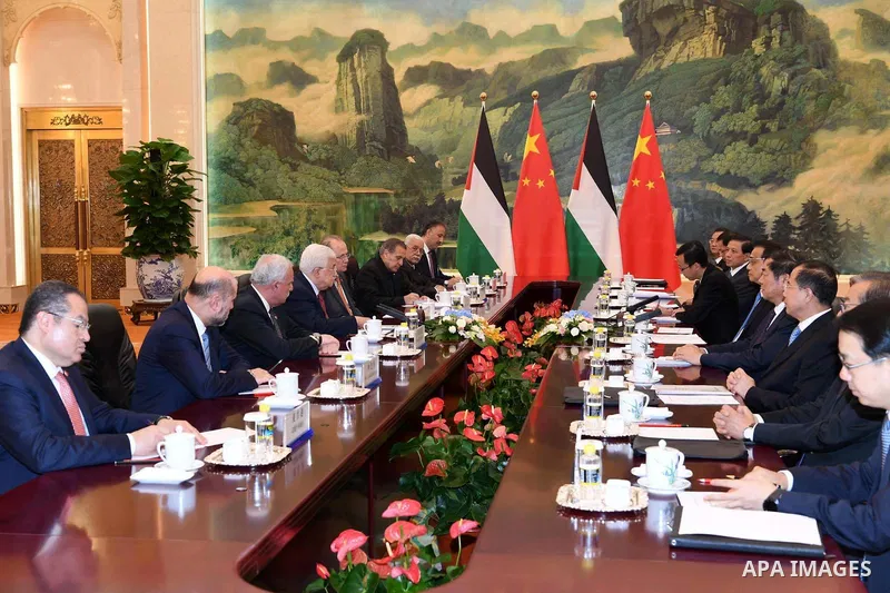 Palestinian President Mahmoud Abbas meets with Chinese Prime Minister Li Keqiang, in Beijing, China, on July 19, 2017. Abbas is on an official visit to China from July 17-20. Photo by Thaer Ganaim