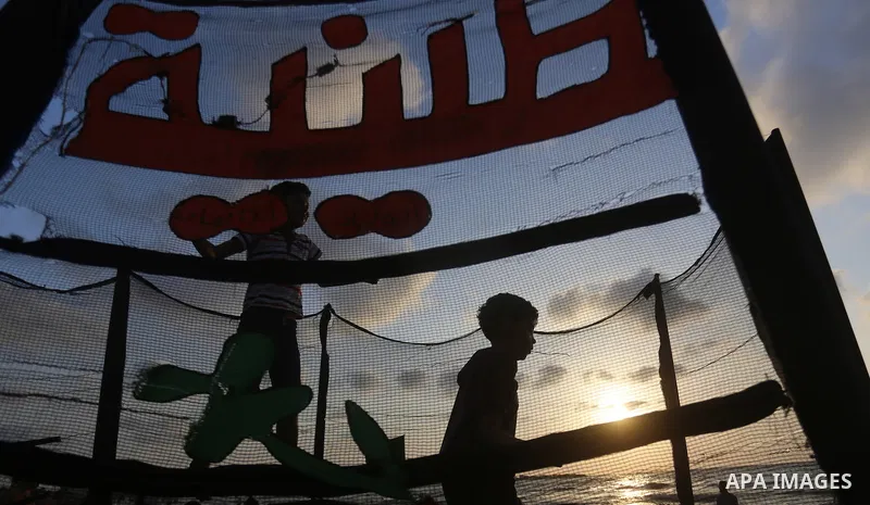 Palestinians enjoy their time at the beach of the Mediterranean sea on the coast of Gaza city on July 19, 2017. Photo by Yasser Qudih