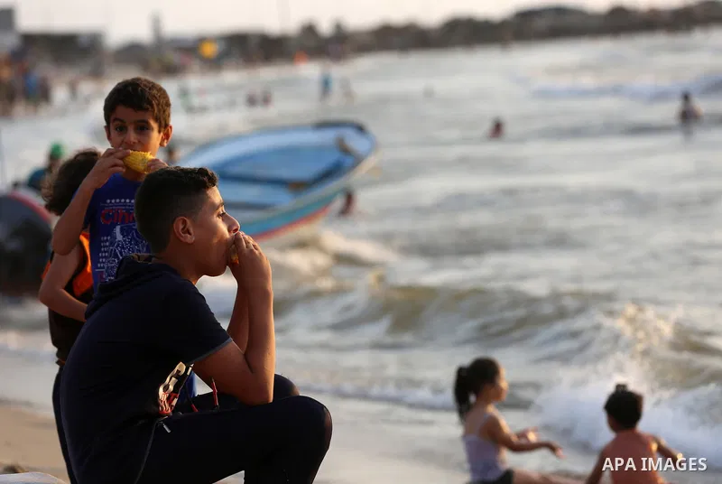 Palestinians swim in the Mediterranean sea on the coast of Gaza city on July 19, 2017. Photo by Yasser Qudih
