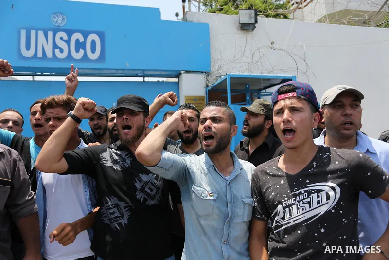 Palestinians Supporters of Fateh movement hold banners and march during a demonstration in Gaza City on July 20, 2017 against new Israeli security measures at Al-Aqsa mosque compound, which include metal detectors and ca...