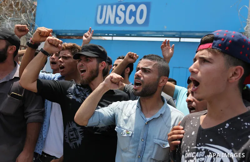 Palestinians Supporters of Fateh movement hold banners and march during a demonstration in Gaza City on July 20, 2017 against new Israeli security measures at Al-Aqsa mosque compound, which include metal detectors and ca...