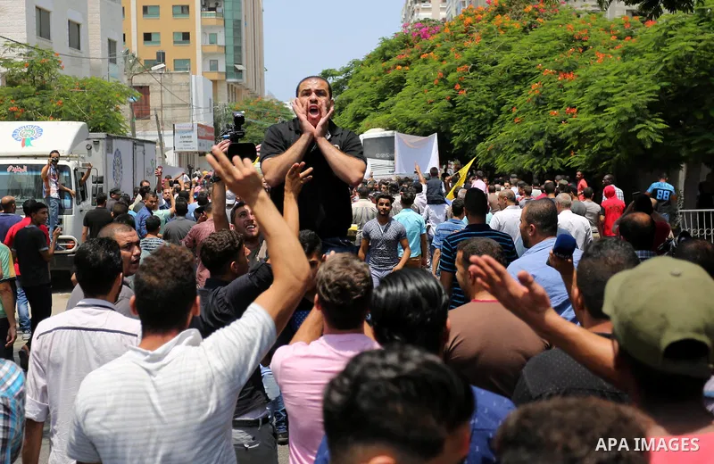 Palestinians Supporters of Fateh movement hold banners and march during a demonstration in Gaza City on July 20, 2017 against new Israeli security measures at Al-Aqsa mosque compound, which include metal detectors and ca...