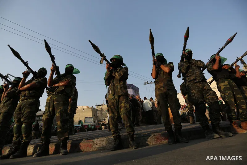 Palestinian Hamas militants take part in a military show against Israel's newly-installed security measures at the entrance to the al-Aqsa mosque compound, in Khan Younis, in the southern Gaza Strip July 20, 2017. Photo...