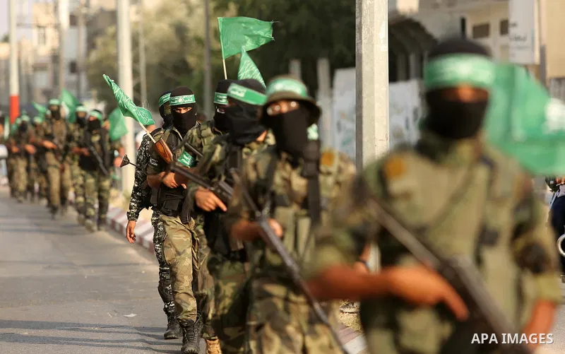 Palestinian Hamas militants take part in a military show against Israel's newly-installed security measures at the entrance to the al-Aqsa mosque compound, in Khan Younis, in the southern Gaza Strip July 20, 2017. Photo...