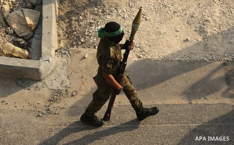 Palestinian Hamas militants take part in a military show against Israel's newly-installed security measures at the entrance to the al-Aqsa mosque compound, in Khan Younis, in the southern Gaza Strip July 20, 2017. Photo...