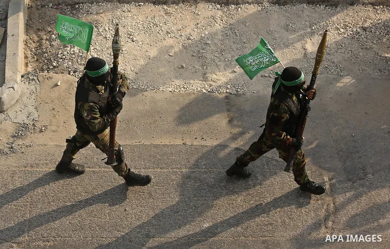 Palestinian Hamas militants take part in a military show against Israel's newly-installed security measures at the entrance to the al-Aqsa mosque compound, in Khan Younis, in the southern Gaza Strip July 20, 2017. Photo...