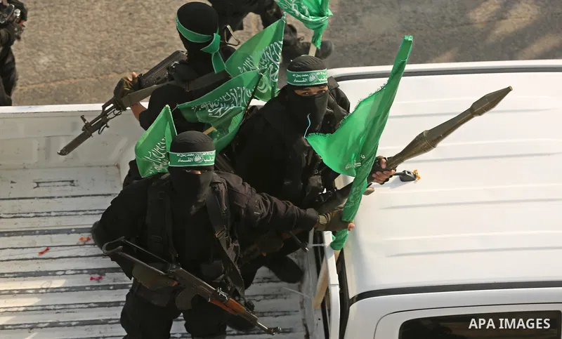 Palestinian Hamas militants take part in a military show against Israel's newly-installed security measures at the entrance to the al-Aqsa mosque compound, in Khan Younis, in the southern Gaza Strip July 20, 2017. Photo...