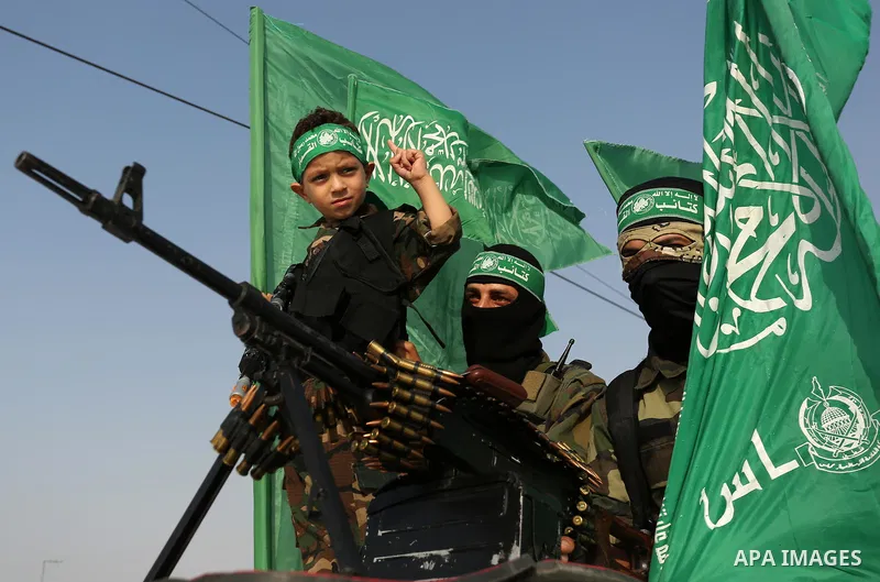 Palestinian Hamas militants take part in a military show against Israel's newly-installed security measures at the entrance to the al-Aqsa mosque compound, in Khan Younis, in the southern Gaza Strip July 20, 2017. Photo...