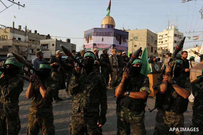 Palestinian Hamas militants take part in a military show against Israel's newly-installed security measures at the entrance to the al-Aqsa mosque compound, in Khan Younis, in the southern Gaza Strip July 20, 2017. Photo...