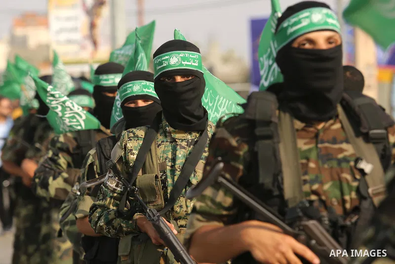 Palestinian Hamas militants take part in a military show against Israel's newly-installed security measures at the entrance to the al-Aqsa mosque compound, in Khan Younis, in the southern Gaza Strip July 20, 2017. Photo...