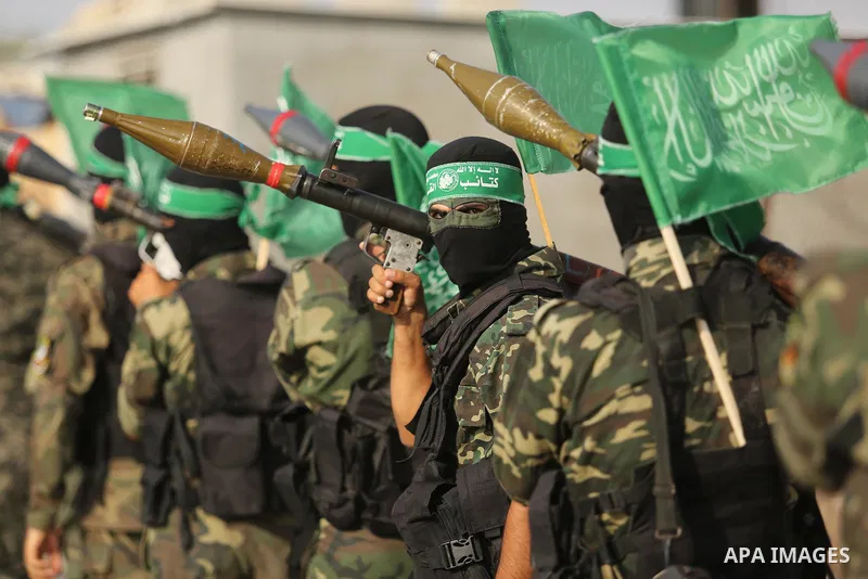 Palestinian Hamas militants take part in a military show against Israel's newly-installed security measures at the entrance to the al-Aqsa mosque compound, in Khan Younis, in the southern Gaza Strip July 20, 2017. Photo...
