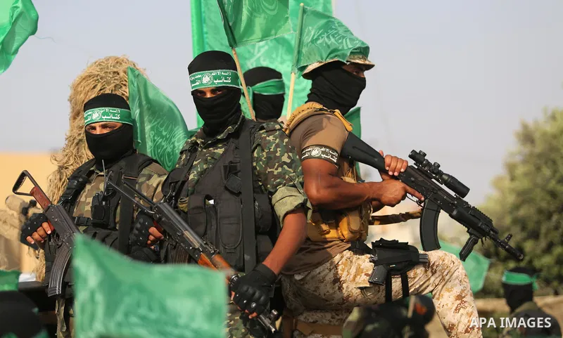 Palestinian Hamas militants take part in a military show against Israel's newly-installed security measures at the entrance to the al-Aqsa mosque compound, in Khan Younis, in the southern Gaza Strip July 20, 2017. Photo...