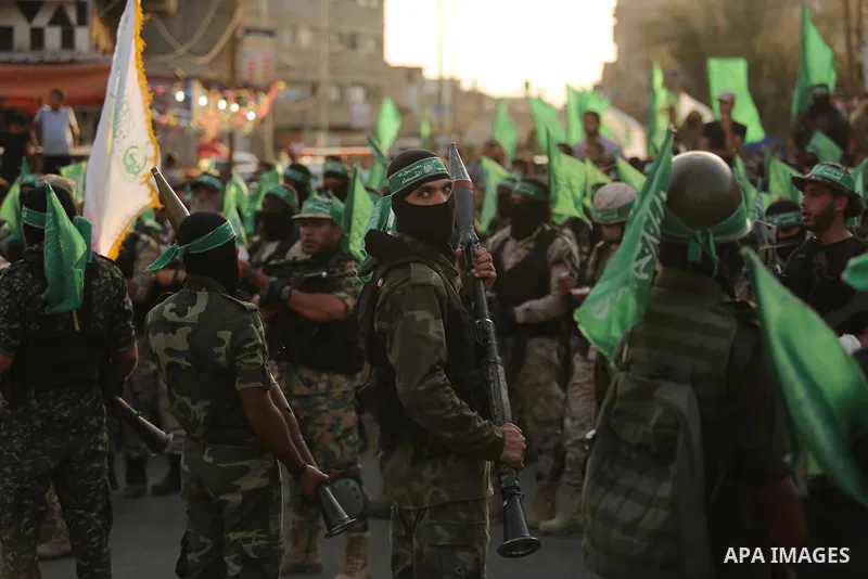 Palestinian Hamas militants take part in a military show against Israel's newly-installed security measures at the entrance to the al-Aqsa mosque compound, in Khan Younis, in the southern Gaza Strip July 20, 2017. Photo...