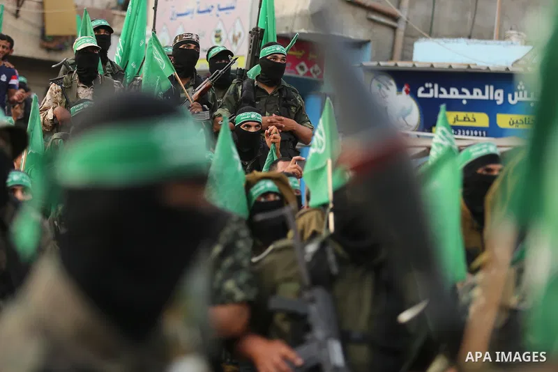 Palestinian Hamas militants take part in a military show against Israel's newly-installed security measures at the entrance to the al-Aqsa mosque compound, in Khan Younis, in the southern Gaza Strip July 20, 2017. Photo...