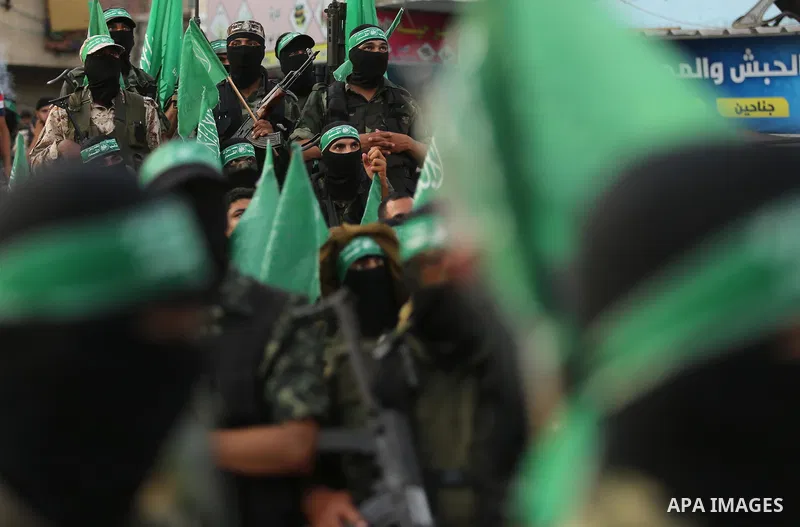 Palestinian Hamas militants take part in a military show against Israel's newly-installed security measures at the entrance to the al-Aqsa mosque compound, in Khan Younis, in the southern Gaza Strip July 20, 2017. Photo...