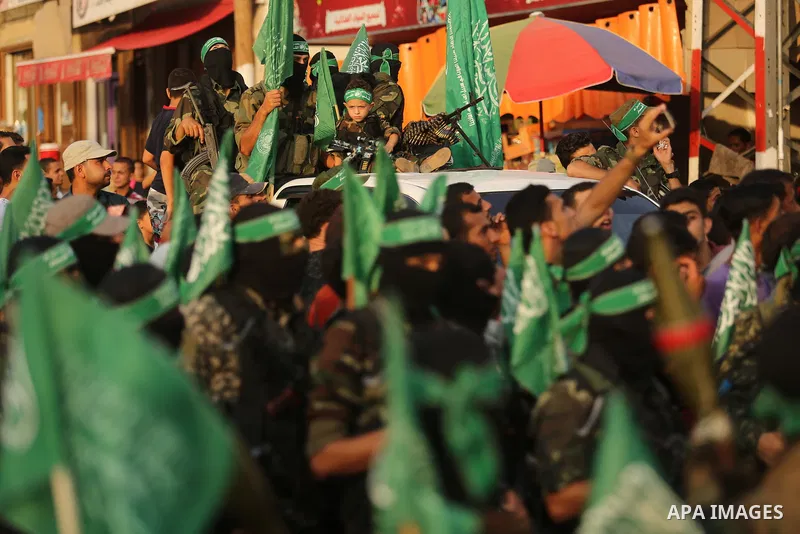 Palestinian Hamas militants take part in a military show against Israel's newly-installed security measures at the entrance to the al-Aqsa mosque compound, in Khan Younis, in the southern Gaza Strip July 20, 2017. Photo...