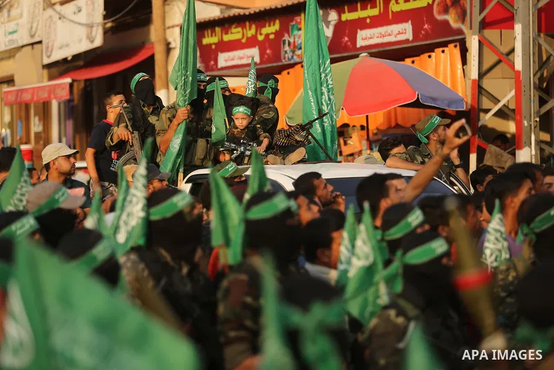 Palestinian Hamas militants take part in a military show against Israel's newly-installed security measures at the entrance to the al-Aqsa mosque compound, in Khan Younis, in the southern Gaza Strip July 20, 2017. Photo...